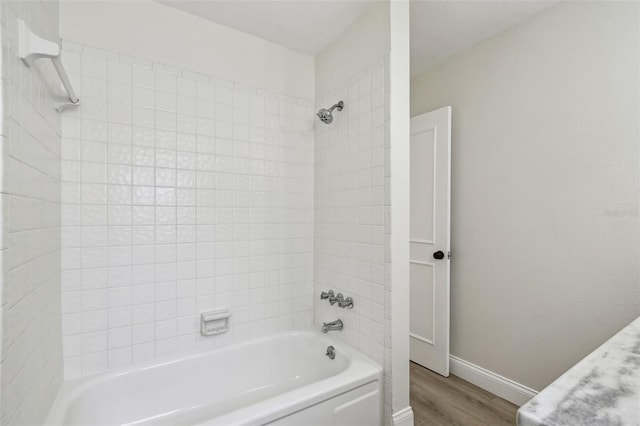 2004 Varner Cir, Winter Haven, FL 33884 - full bath with shower / bath combination and wood finished floors