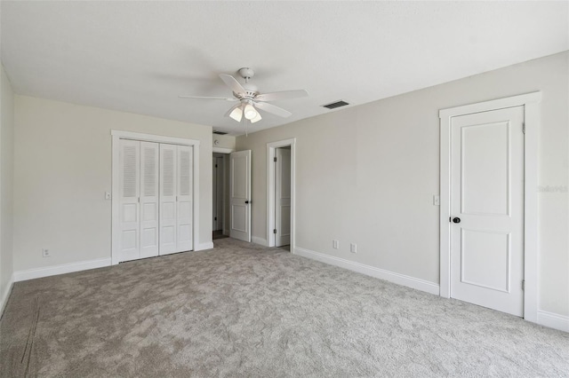 2004 Varner Cir, Winter Haven, FL 33884 - unfurnished bedroom featuring carpet flooring, ceiling fan, and a closet