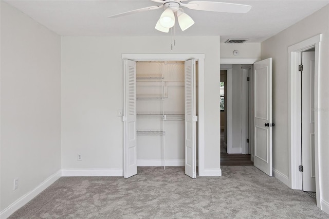2004 Varner Cir, Winter Haven, FL 33884 - unfurnished bedroom featuring carpet flooring, a closet, and a ceiling fan