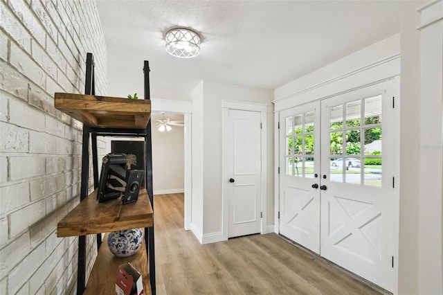 2004 Varner Cir, Winter Haven, FL 33884 - foyer with wood finished floors, concrete block wall, and a wood stove