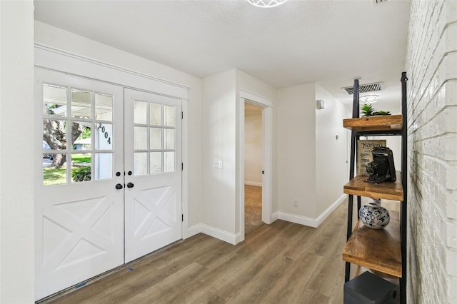 2004 Varner Cir, Winter Haven, FL 33884 - entrance foyer featuring wood finished floors and french doors