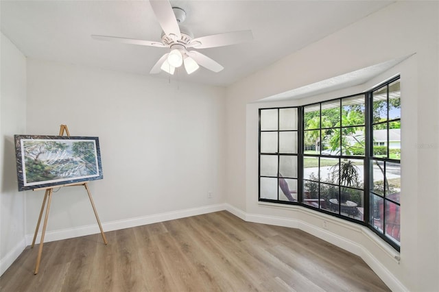 2004 Varner Cir, Winter Haven, FL 33884 - unfurnished room featuring light wood finished floors and a ceiling fan