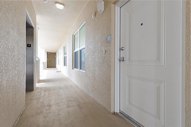 125 Island Way Unit 403, Clearwater, FL 33767 - doorway to property featuring stucco siding