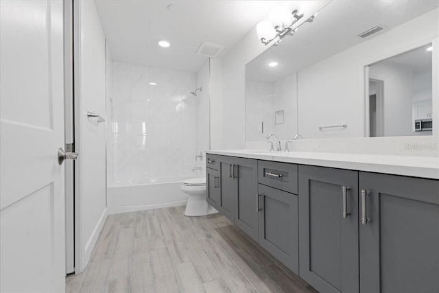 125 Island Way Unit 403, Clearwater, FL 33767 - full bathroom with vanity, shower / tub combination, wood finished floors, and recessed lighting