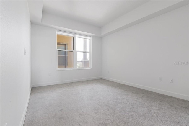 125 Island Way Unit 403, Clearwater, FL 33767 - carpeted empty room featuring baseboards