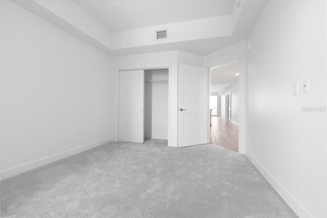 125 Island Way Unit 403, Clearwater, FL 33767 - unfurnished bedroom with carpet and a closet