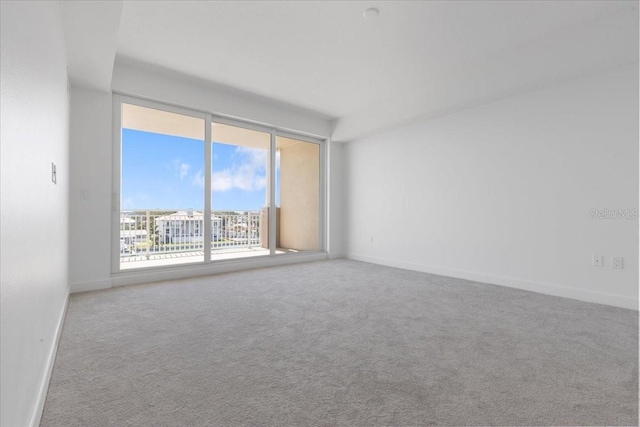 125 Island Way Unit 403, Clearwater, FL 33767 - carpeted spare room featuring baseboards