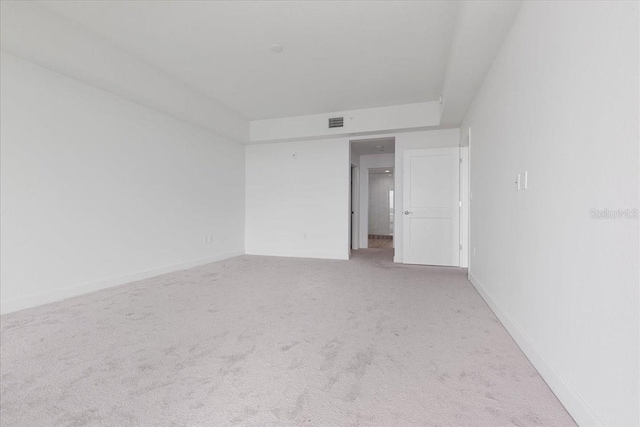125 Island Way Unit 403, Clearwater, FL 33767 - empty room with light colored carpet and baseboards
