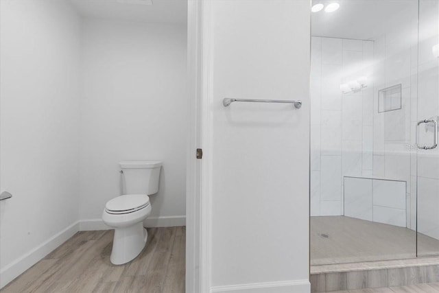 125 Island Way Unit 403, Clearwater, FL 33767 - full bathroom featuring a shower stall and wood finished floors