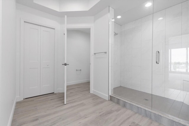 125 Island Way Unit 403, Clearwater, FL 33767 - bathroom with a stall shower, wood finished floors, and recessed lighting