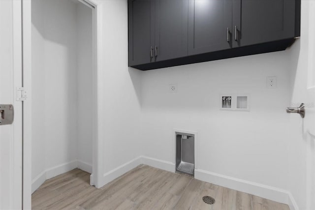 125 Island Way Unit 403, Clearwater, FL 33767 - laundry room with cabinet space, light wood finished floors, hookup for an electric dryer, and hookup for a washing machine
