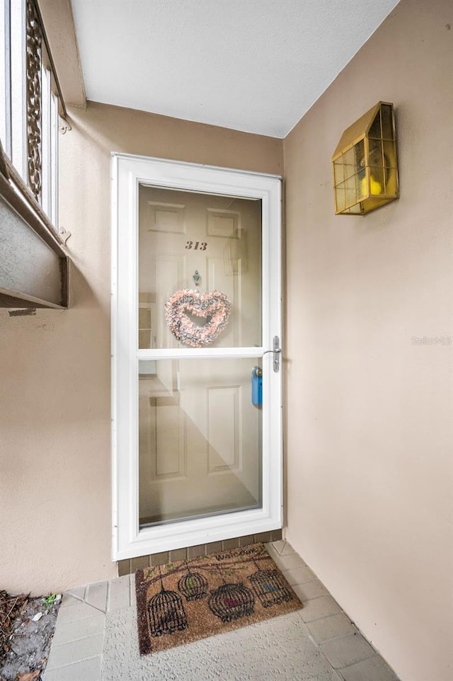 5265 E Bay Dr Unit 313, Clearwater, FL 33764 - view of exterior entry with stucco siding