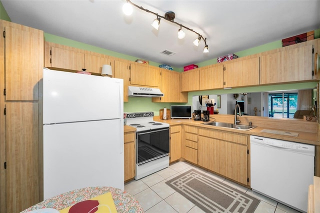 5265 E Bay Dr Unit 313, Clearwater, FL 33764 - kitchen with white appliances, extractor fan, light tile patterned floors, and light countertops