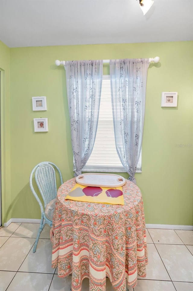 5265 E Bay Dr Unit 313, Clearwater, FL 33764 - dining room with light tile patterned floors and baseboards