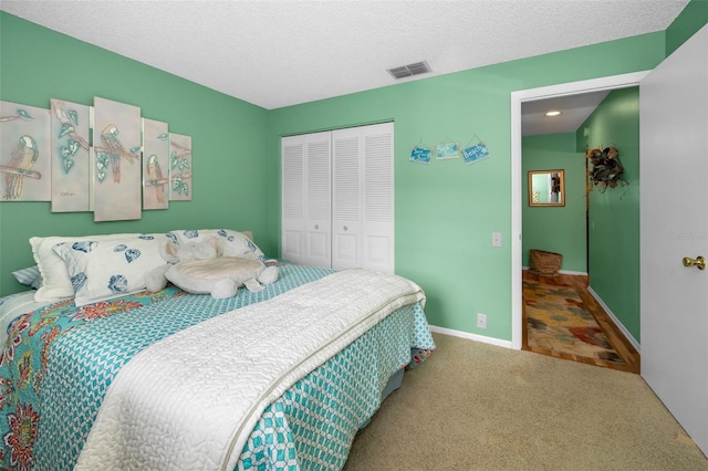 5265 E Bay Dr Unit 313, Clearwater, FL 33764 - carpeted bedroom featuring a closet and a textured ceiling