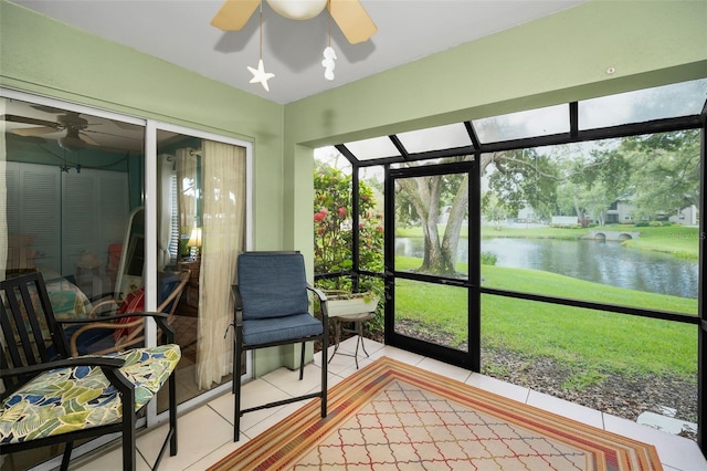 5265 E Bay Dr Unit 313, Clearwater, FL 33764 - sunroom featuring ceiling fan and a water view