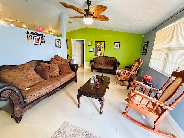 4239 Cardoon Dr, New Port Richey, FL 34653 - living area with lofted ceiling, ceiling fan, and tile patterned floors
