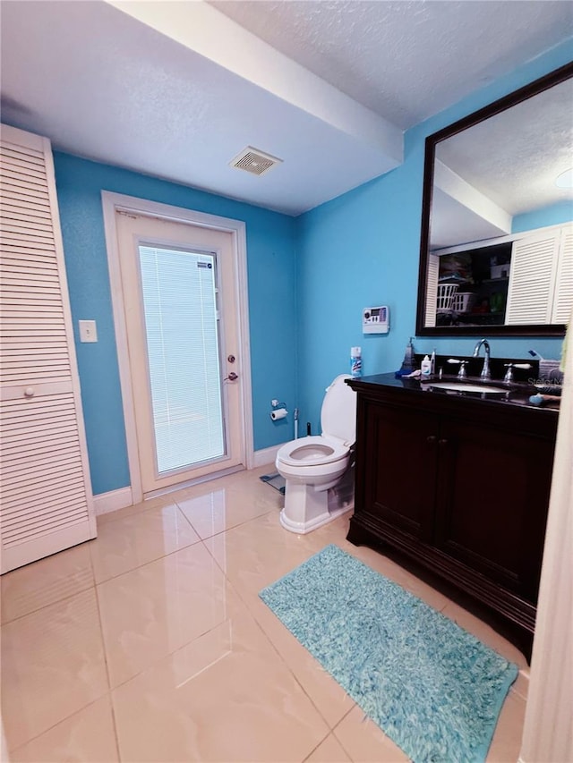 4239 Cardoon Dr, New Port Richey, FL 34653 - bathroom featuring a textured ceiling, vanity, and tile patterned floors