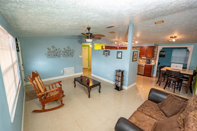 4239 Cardoon Dr, New Port Richey, FL 34653 - living room with ceiling fan and a textured ceiling