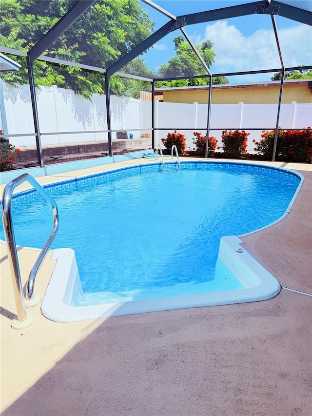 4239 Cardoon Dr, New Port Richey, FL 34653 - view of pool featuring a fenced backyard, a lanai, and a patio area