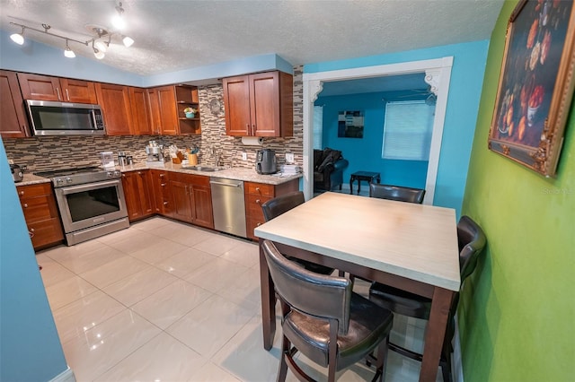 4239 Cardoon Dr, New Port Richey, FL 34653 - kitchen featuring appliances with stainless steel finishes, open shelves, decorative backsplash, brown cabinetry, and a textured ceiling