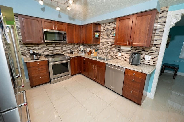 4239 Cardoon Dr, New Port Richey, FL 34653 - kitchen with appliances with stainless steel finishes, tasteful backsplash, open shelves, a textured ceiling, and light stone counters