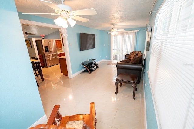 4239 Cardoon Dr, New Port Richey, FL 34653 - living room with a textured ceiling, a ceiling fan, and light tile patterned floors
