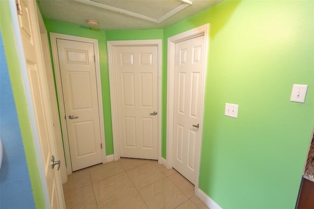 4239 Cardoon Dr, New Port Richey, FL 34653 - corridor with light tile patterned flooring and baseboards