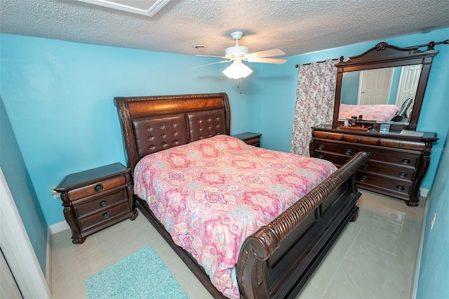 4239 Cardoon Dr, New Port Richey, FL 34653 - tiled bedroom featuring a textured ceiling and a ceiling fan