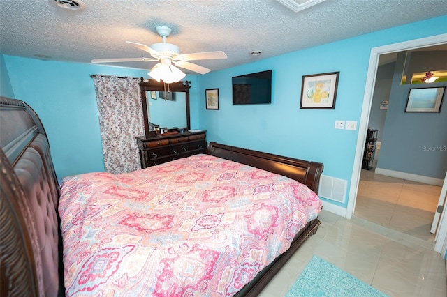 4239 Cardoon Dr, New Port Richey, FL 34653 - tiled bedroom featuring a textured ceiling and a ceiling fan