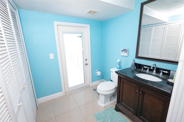 4239 Cardoon Dr, New Port Richey, FL 34653 - bathroom featuring a closet, vanity, and tile patterned floors