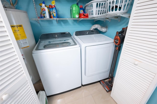 4239 Cardoon Dr, New Port Richey, FL 34653 - laundry room with separate washer and dryer, water heater, and light tile patterned floors
