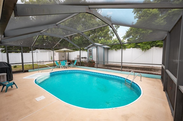 4239 Cardoon Dr, New Port Richey, FL 34653 - view of pool featuring a storage unit, a patio, a fenced backyard, area for grilling, and glass enclosure