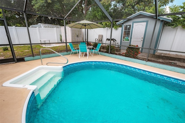 4239 Cardoon Dr, New Port Richey, FL 34653 - view of pool featuring a storage unit, a patio area, a fenced backyard, glass enclosure, and outdoor dining space