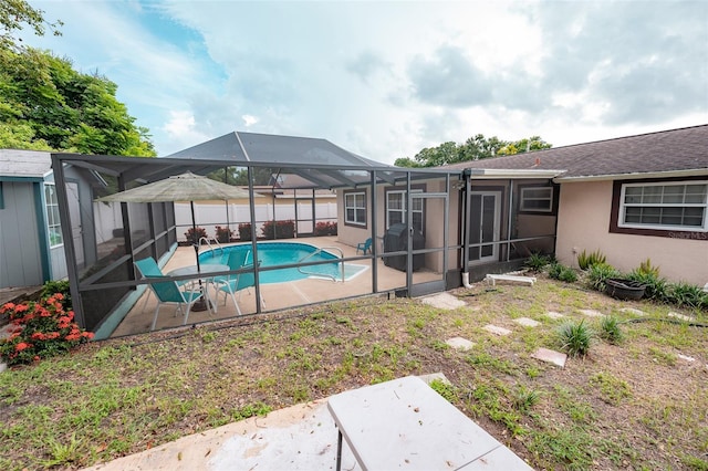 4239 Cardoon Dr, New Port Richey, FL 34653 - view of swimming pool featuring a patio area and glass enclosure