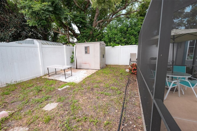 4239 Cardoon Dr, New Port Richey, FL 34653 - fenced backyard featuring a storage shed and a patio