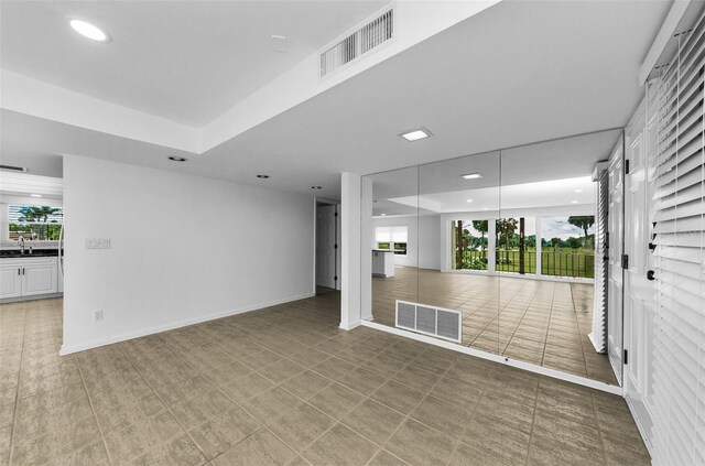 3021 Countryside Blvd Unit 28A, Clearwater, FL 33761 - unfurnished room featuring recessed lighting and a tray ceiling