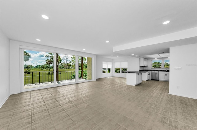 3021 Countryside Blvd Unit 28A, Clearwater, FL 33761 - unfurnished living room featuring healthy amount of natural light and recessed lighting
