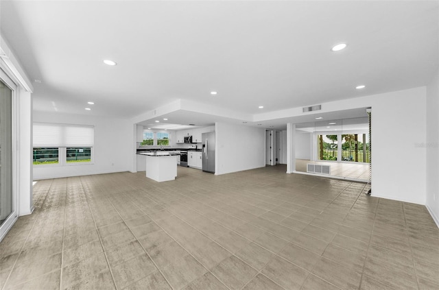 3021 Countryside Blvd Unit 28A, Clearwater, FL 33761 - unfurnished living room with recessed lighting