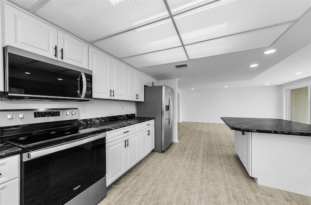 3021 Countryside Blvd Unit 28A, Clearwater, FL 33761 - kitchen with stainless steel appliances, white cabinetry, and recessed lighting