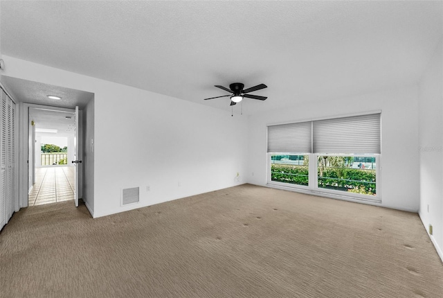 3021 Countryside Blvd Unit 28A, Clearwater, FL 33761 - carpeted empty room with a ceiling fan