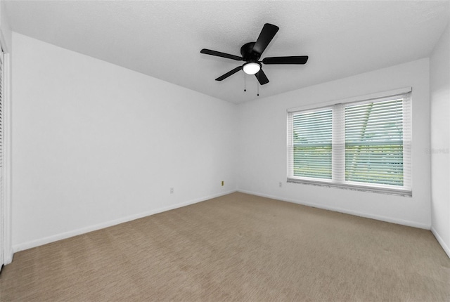 3021 Countryside Blvd Unit 28A, Clearwater, FL 33761 - carpeted spare room with baseboards and ceiling fan