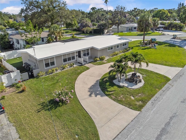 327 Sunny Ln, Belleair, FL 33756 - view of front of home featuring curved driveway, stucco siding, and a residential view