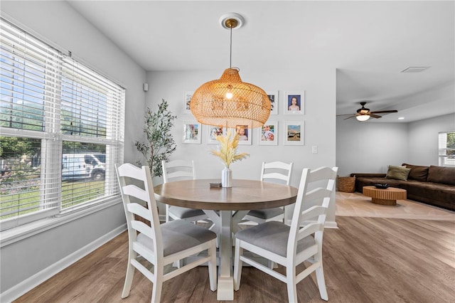 327 Sunny Ln, Belleair, FL 33756 - dining room with wood finished floors and a ceiling fan