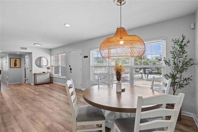 327 Sunny Ln, Belleair, FL 33756 - dining area featuring healthy amount of natural light, light wood-style floors, and recessed lighting