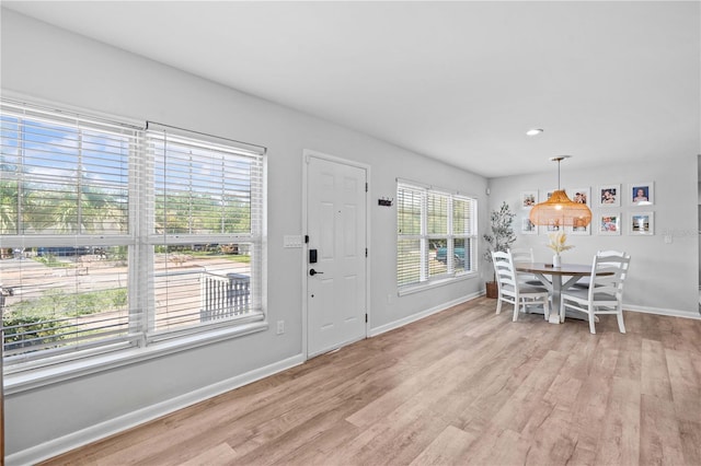 327 Sunny Ln, Belleair, FL 33756 - foyer with light wood-style floors and baseboards