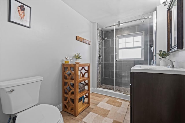 327 Sunny Ln, Belleair, FL 33756 - bathroom featuring vanity, a shower stall, and wood finished floors
