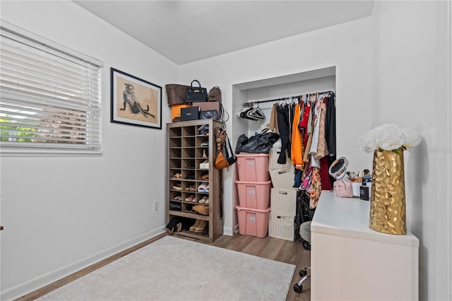 327 Sunny Ln, Belleair, FL 33756 - bedroom with an office area and wood finished floors