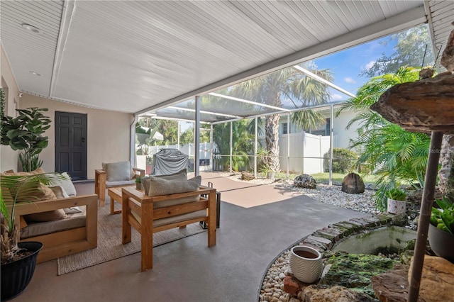 327 Sunny Ln, Belleair, FL 33756 - view of patio featuring a lanai and an outdoor living space