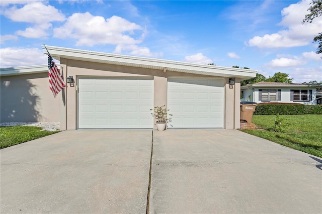 327 Sunny Ln, Belleair, FL 33756 - garage featuring concrete driveway